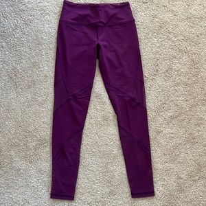 Purple leggings with mesh on the sides